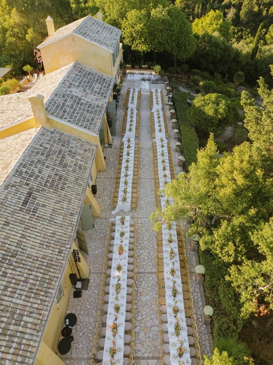 Aerial view of the estate and outdoor banquet setup